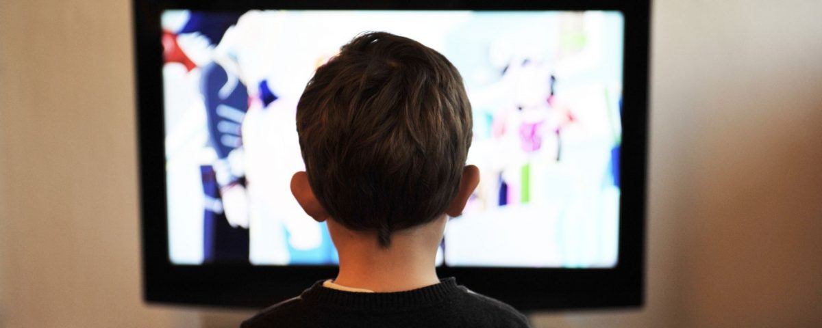kid watching children's programming on tv