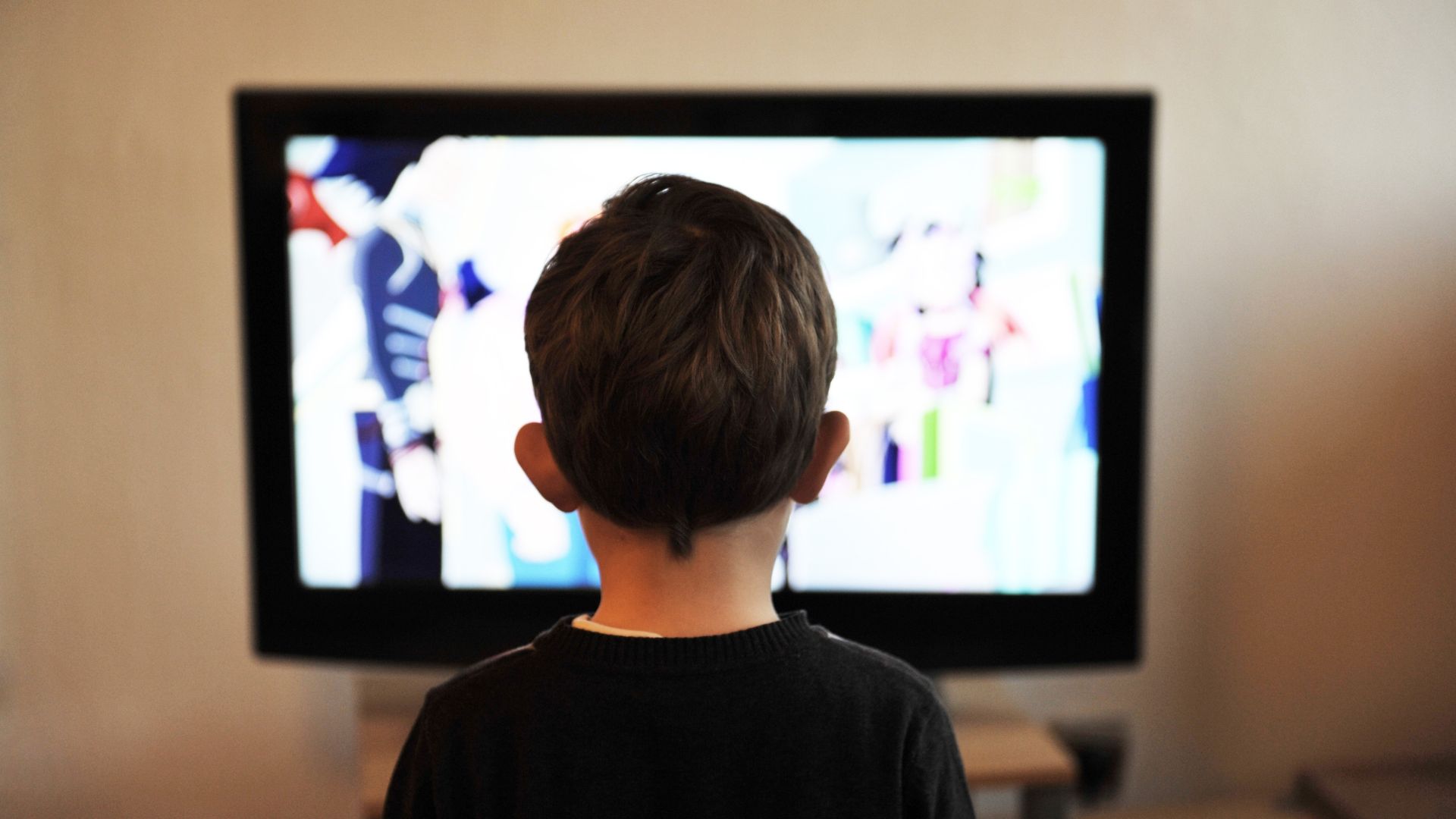 kid watching children's programming on tv